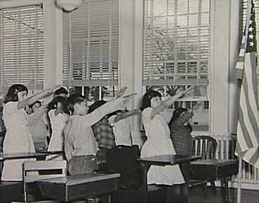Bellamy salute: Students pledging allegiance to the American flag with the Bellamy salute.; National Socialism; Nazis; educational hegemony; socialism