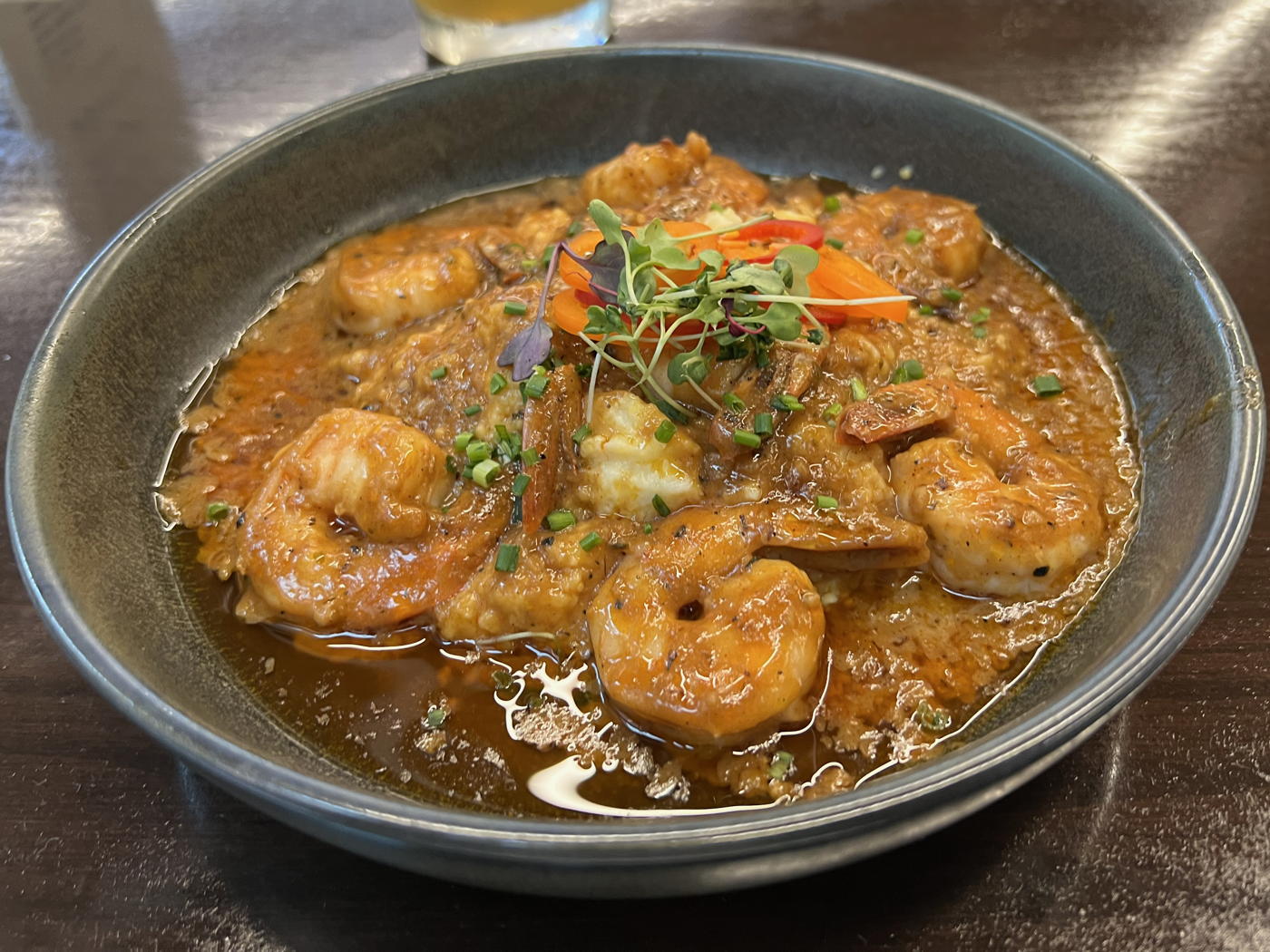 American Sector Shrimp and Grits: Shrimp and grits at the American Sector Bar and Grill in the National World War II Museum of New Orleans.; restaurants; New Orleans; shrimp; grits