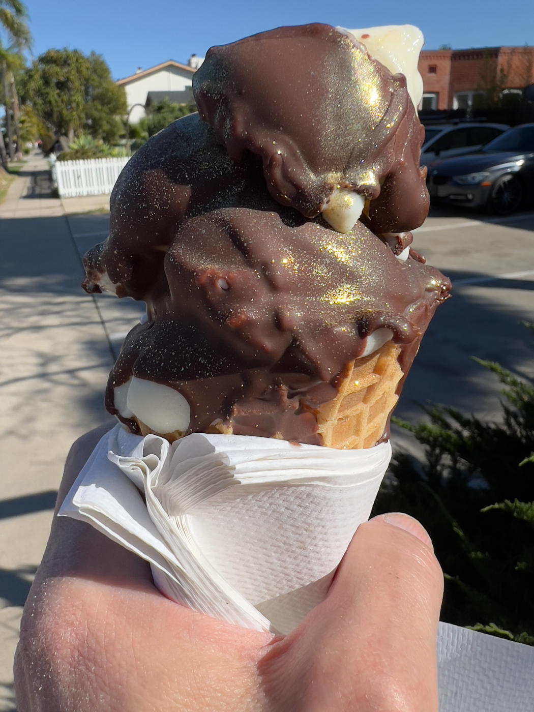 Golden Ice Cream Cone: Gold-flecked chocolate ice cream cone from Eclipse in Golden Hill, San Diego.; Golden Hill; ice cream