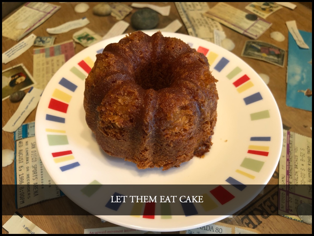 Let them eat cake: “Let them eat cake” over a photo of a mini-bundt orange rum cake.; history; cake