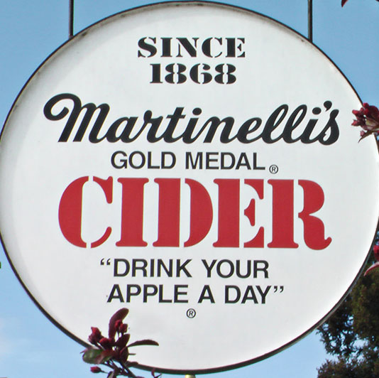 Drink Your Apple a Day: Martinelli’s sign with their slogan, “Drink Your Apple A Day”.; beverages; drinks; apples; Martinelli’s