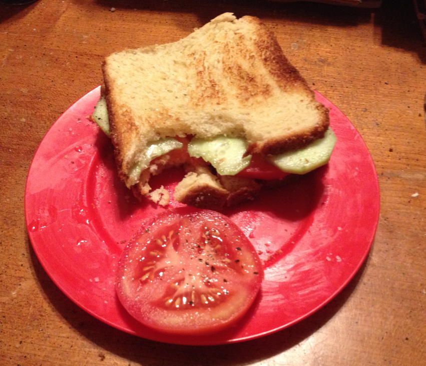 Tomato cucumber sandwich: A tomato-cucumber sandwich on toast.; sandwiches
