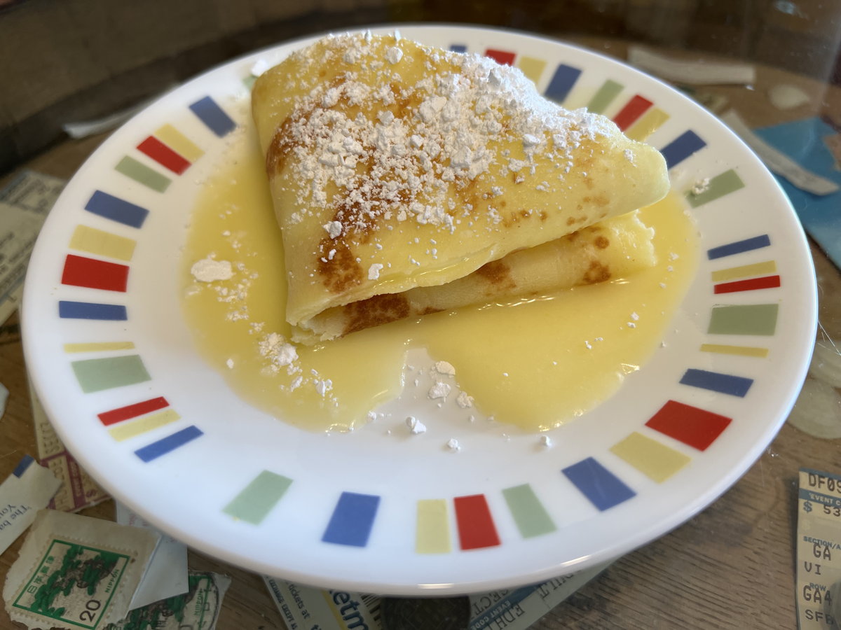 Crêpe with orange sauce: Crêpe Suzette, from Eddie Doucette’s 1954 television show, Home Cooking.; oranges; Eddie Doucette; crêpes