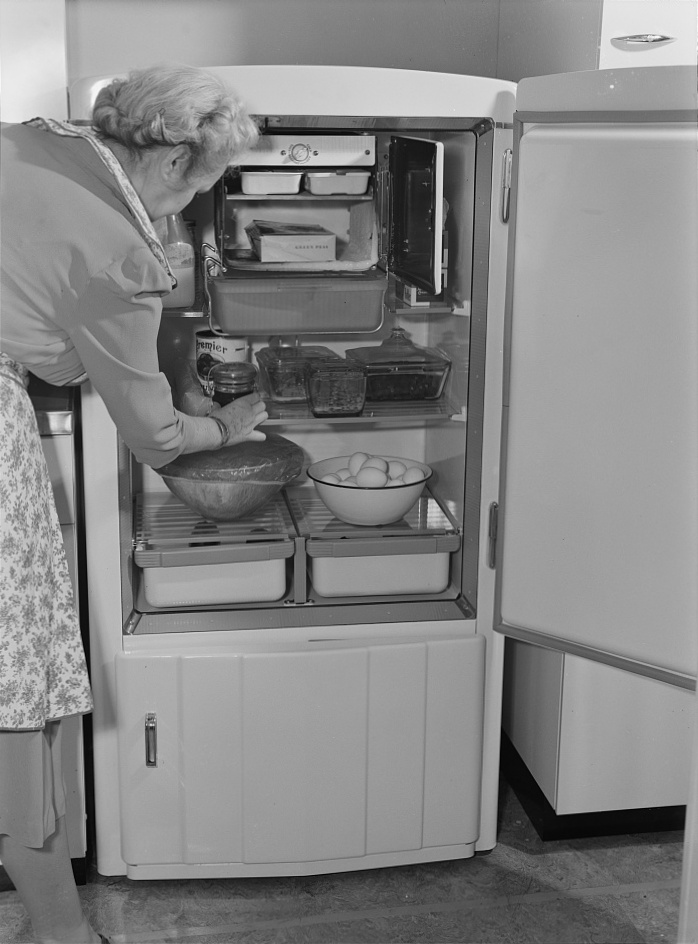 Properly-arranged refrigerator: “You’ll probably find new friends during this war, but you may not find a new refrigerator, so keep yours in good condition. To assure best results, arrange food properly, meat and milk closest to freezing unit. Don’t overcrowd, as this prevents circulation of air…”—Ann Rosener, photographer, February 1942; refrigerators