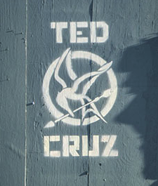 Mockingjay Ted Cruz: Images found around Los Angeles by street artists in 2015 comparing Ted Cruz’s candidacy to insurgent Katniss from The Hunger Games.; Senator Ted Cruz; Mockingjay; Hunger Games