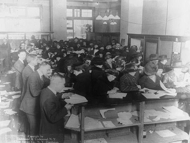 1920 tax filers: People fill out tax forms in 1920.; taxes; IRS; Internal Revenue Service