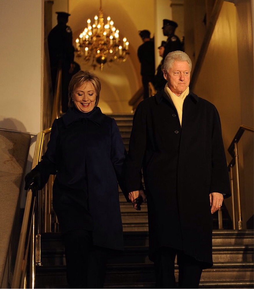 Hillary Rodham Clinton and husband at the 56th Inauguration: Secretary of State-nominee Hillary Rodham Clinton and husband, former President Bill Clinton descend the stairs at the U.S. Capitol for the start of the 56th Presidential Inauguration in Washington, D.C., Jan. 20, 2009.; Bill Clinton; Hillary Clinton