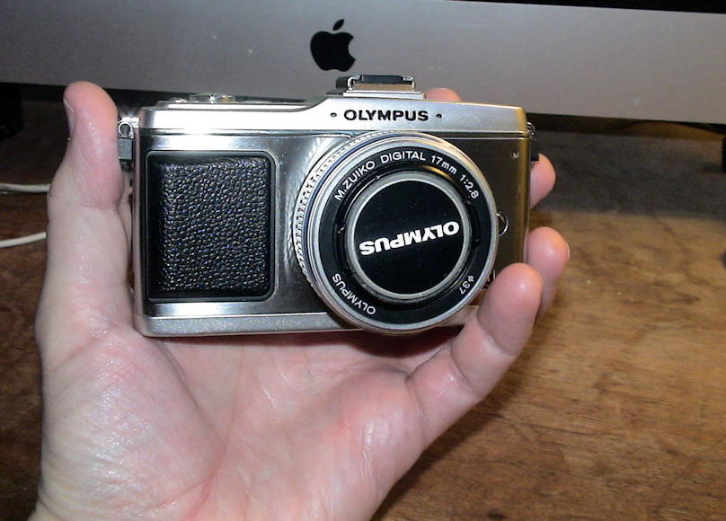 Olympus Pen E-P2 with 17mm lens: The Olympus Pen E-P2 with a 17mm pancake lens, fits in the palm of my hand.; cameras