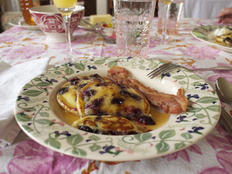 Easter breakfast: An Easter breakfast of blueberry pancakes and sausage, with mimosa.; food