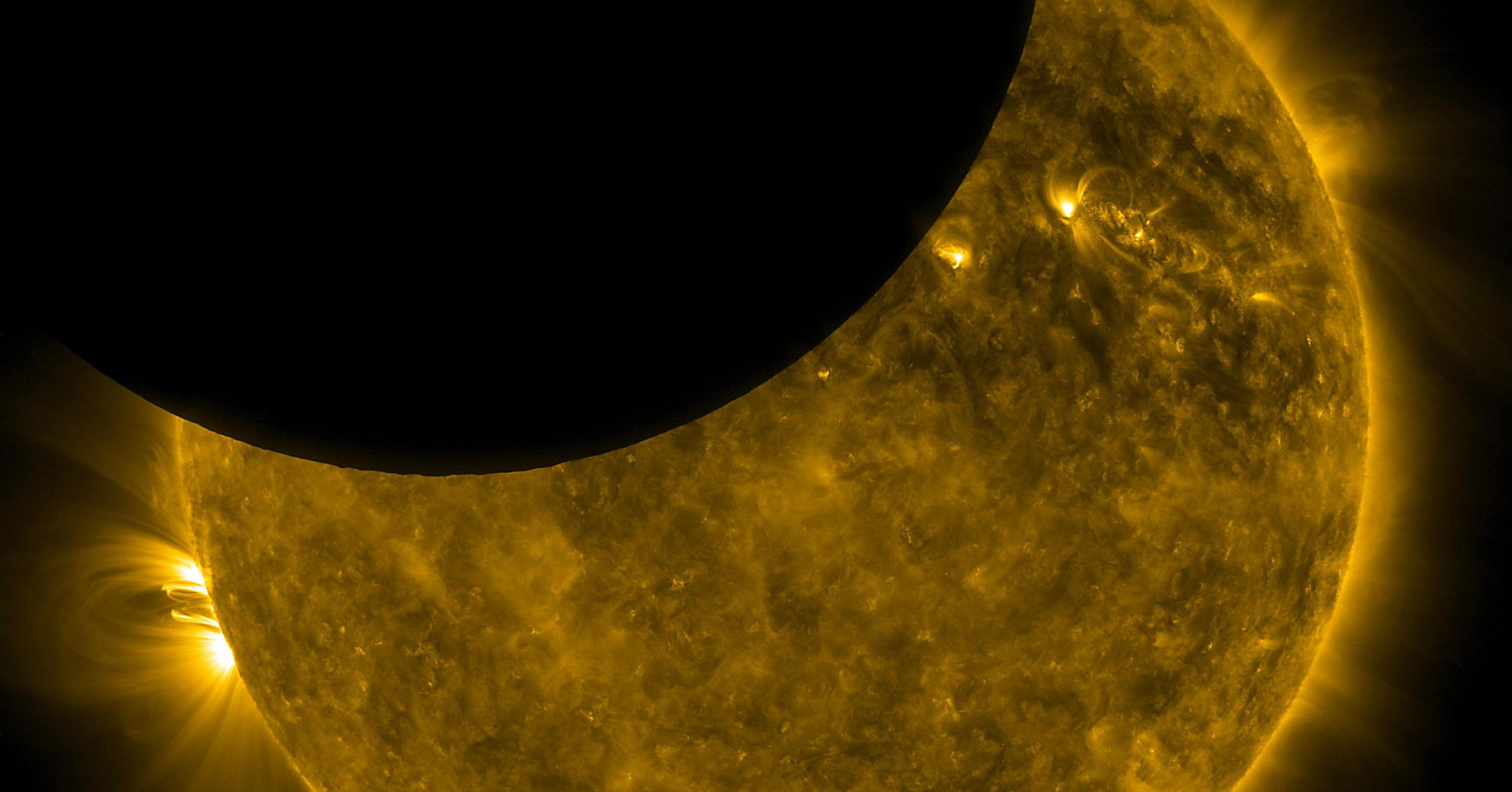 SDO lunar transit: On Oct. 7, 2010, NASA’s Solar Dynamics Observatory observed its first lunar transit when the new moon passed directly between the spacecraft (in its geosynchronous orbit) and the sun. With SDO watching the sun in a wavelength of extreme ultraviolet light, the dark moon created a partial eclipse of the sun.; The Moon; solar eclipse; the sun