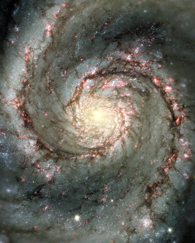 Whirlpool Galaxy: This Hubble composite image shows visible starlight as well as light from the emission of glowing hydrogen, which is associated with the most luminous young stars in the spiral arms.  The Whirlpool Galaxy, also known as M51 or NGC 5194, is having a close encounter with a nearby companion galaxy, NGC 5195, just off the upper edge of this image. The companion&#39;s gravitational pull is triggering star formation in the main galaxy, as seen in brilliant detail by numerous, luminous clusters of young and energetic stars. The bright clusters are highlighted in red by their associated emission from glowing hydrogen gas.; space; galaxies