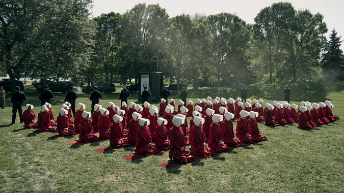 Kneeling handmaids: Scene from the first episode of The Handmaid’s Tale on Hulu.; The Handmaid’s Tale; Hulu